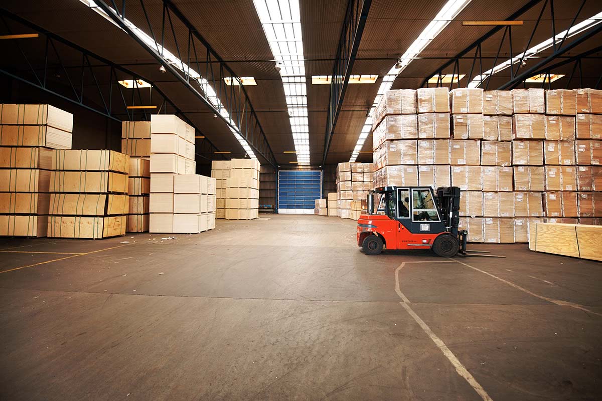 Shop-1 A large warehouse storing big boxes with a forklift.
